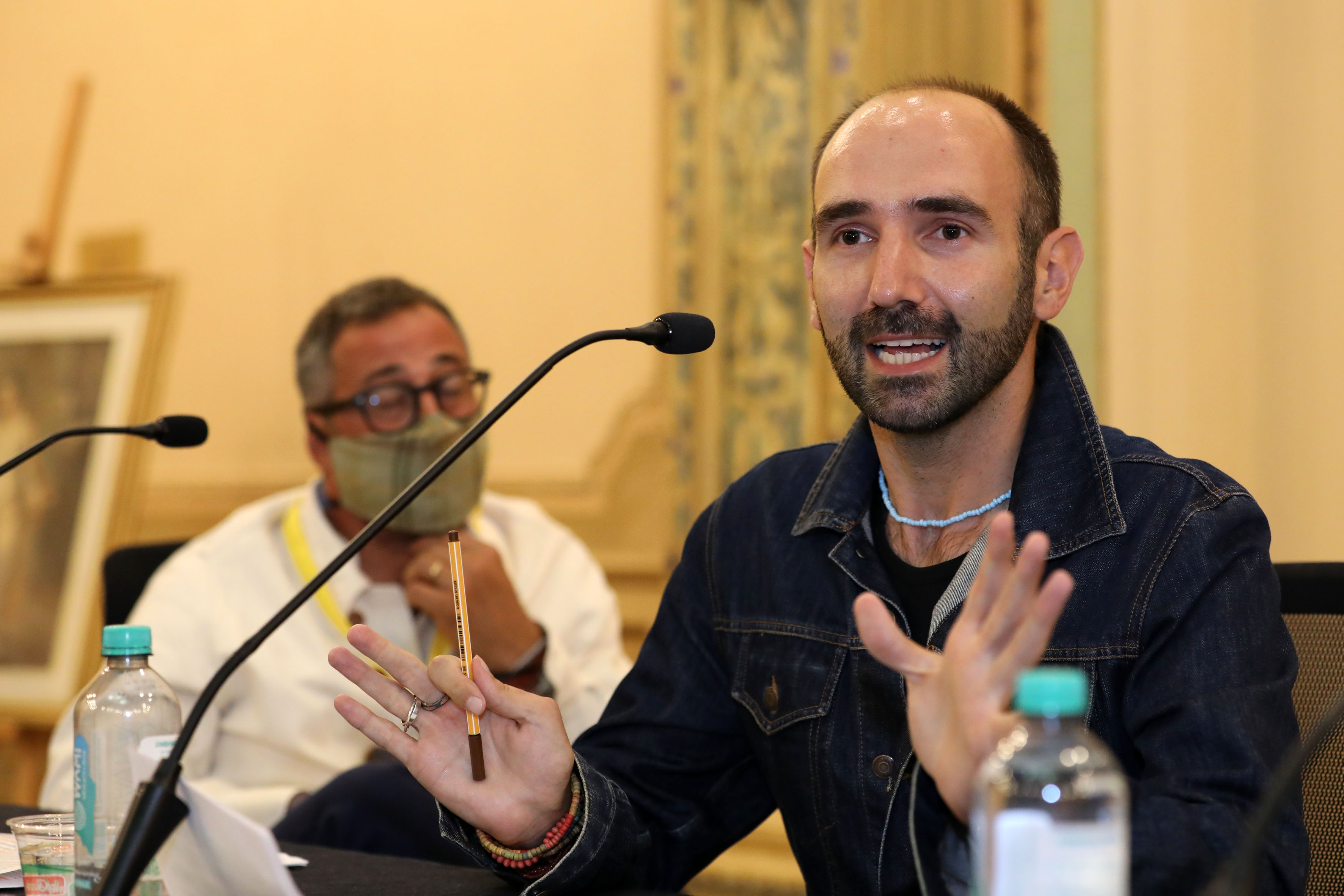 Dr. Hakan Karaosman giving a speech 