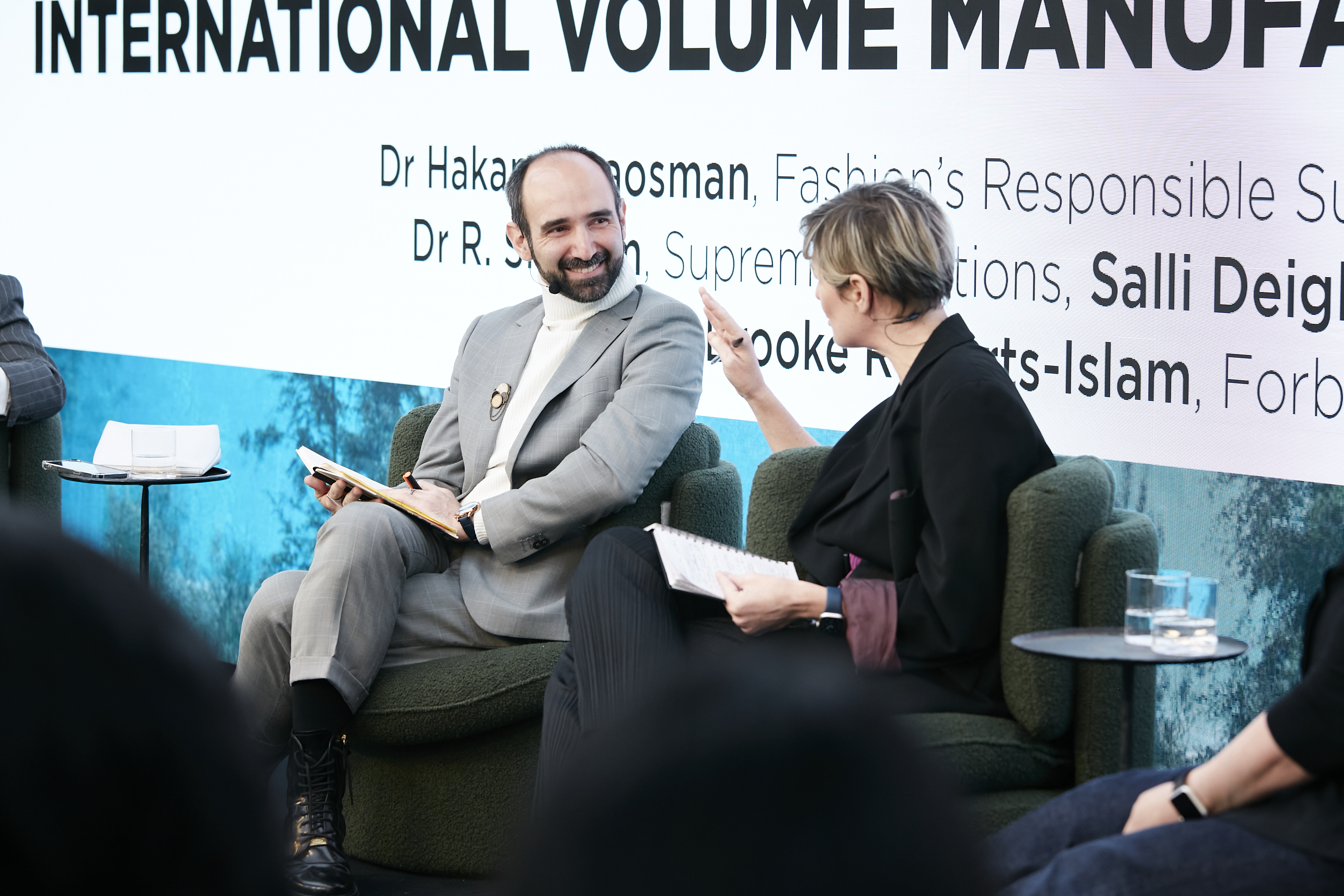 Dr. Hakan Karaosman giving a speech 